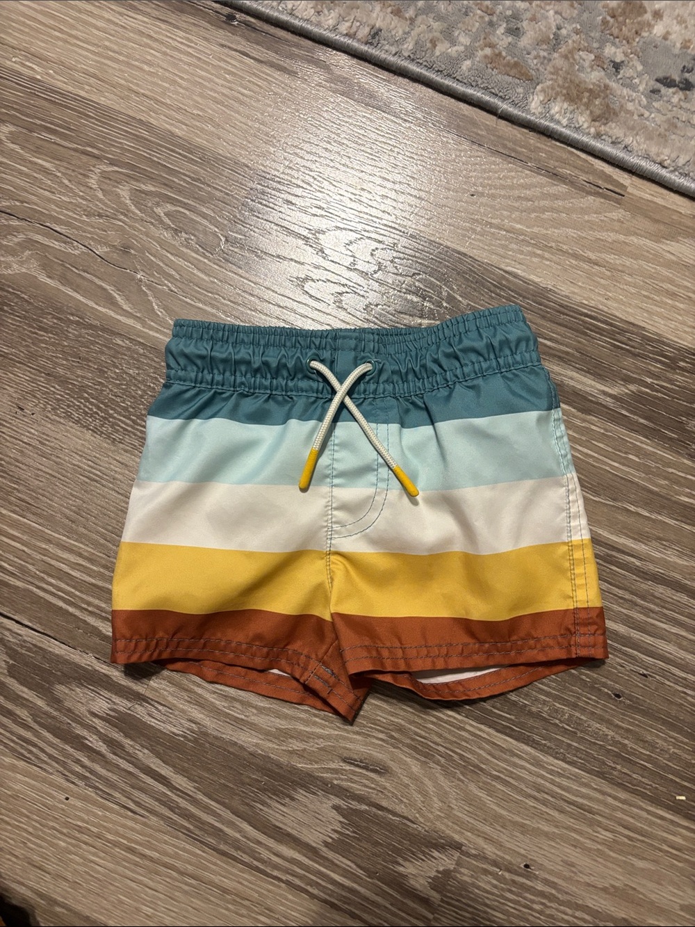 Cat & Jack Boys Striped Swim Trunks in Teal, Light Blue, White, Yellow & Brown
